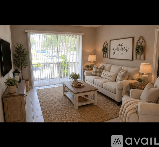 A living room with a white couch and a coffee table.