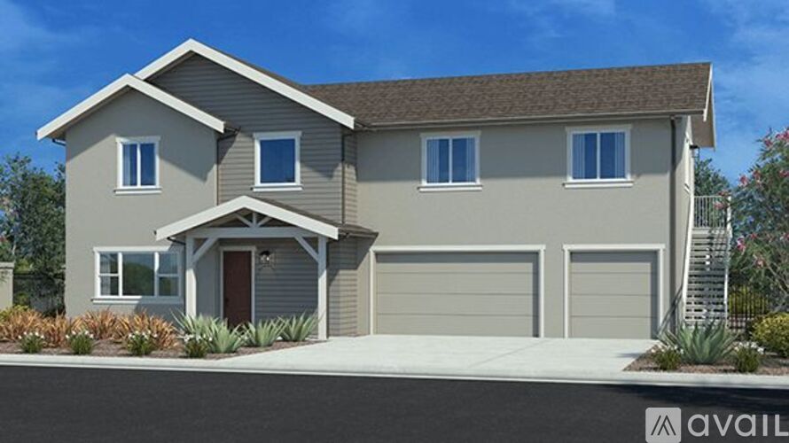 A modern house with a brown roof and a garage door.