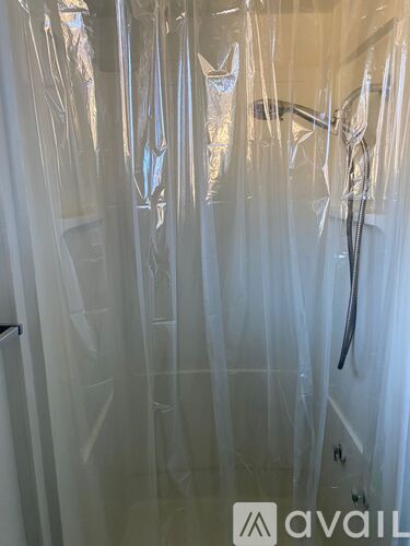 A shower covered in plastic wrap.