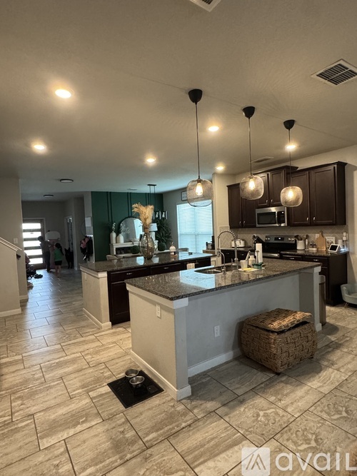 A kitchen with a large island in the middle of the room.