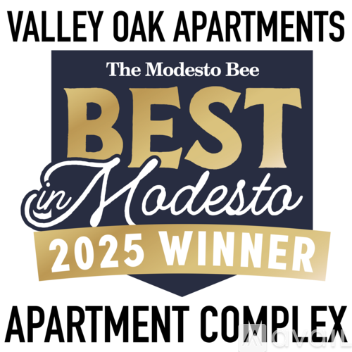 The image displays a badge indicating that Valley Oak Apartments has won the title of "Best in Modesto" for the year 2025.