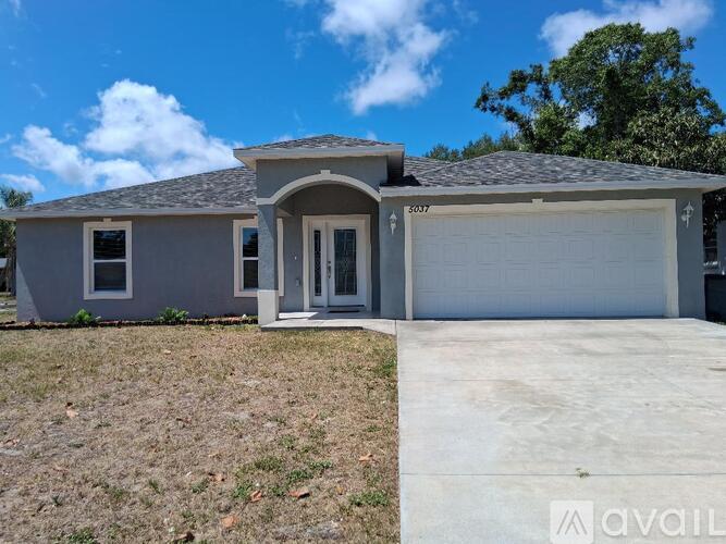 A house with a garage is available for sale.