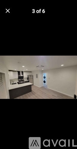 A room with a desk and a chair in it.