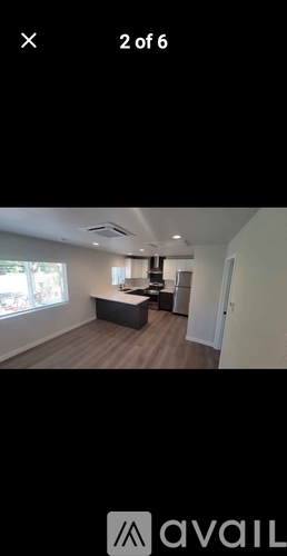 A room with a desk and a chair is shown in the image.