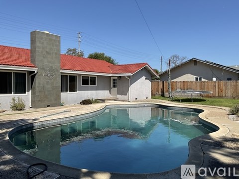 A house with a pool in the backyard.