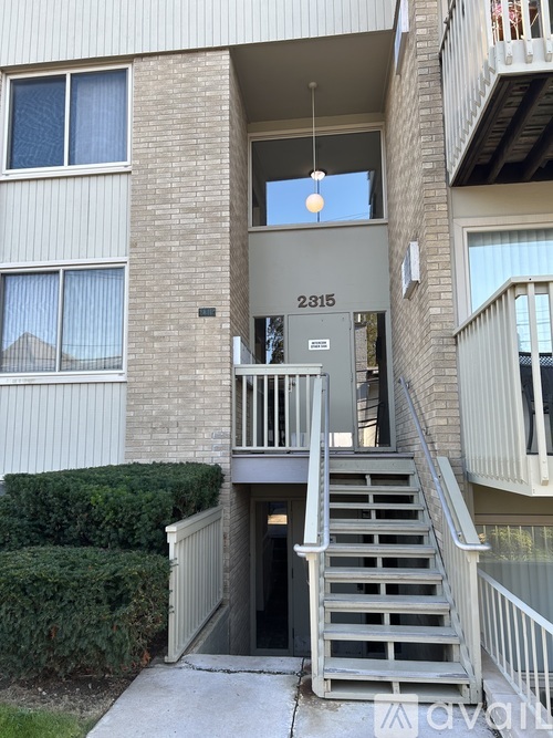 Apartment building with the number 2315 on the door.