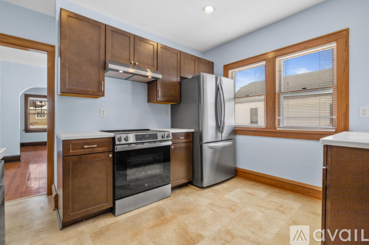 A kitchen with a stove, oven, and refrigerator.