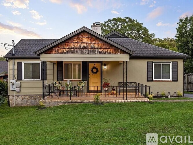 A house with a front porch and a covered entrance.