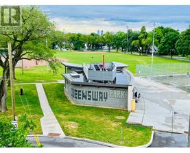 A park with a building that says "SNEWSLAP" on it.