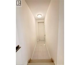 A long hallway with a door at the end.