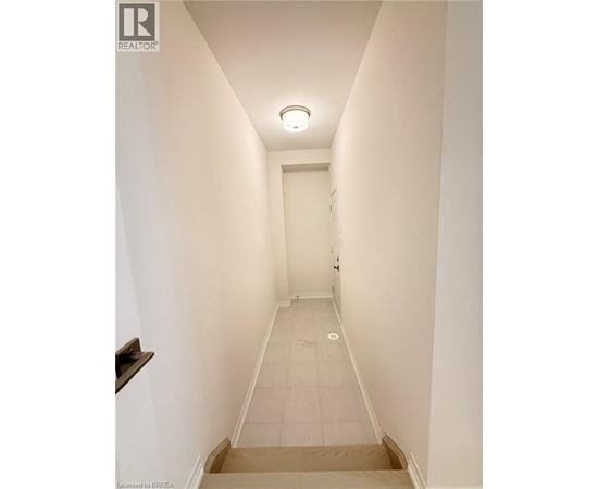 A long hallway with a door at the end.