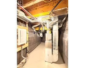 A room with a lot of pipes and ducts.