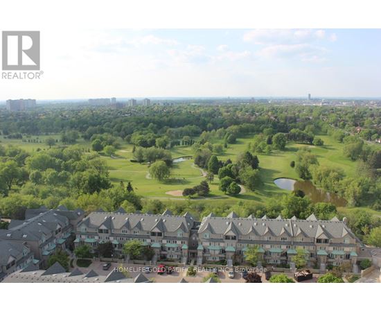 A bird's eye view of a golf course surrounded by buildings.