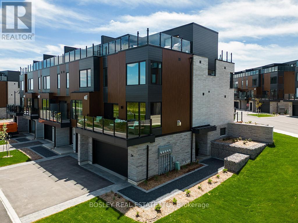 A modern multi-story residential building with a mix of dark and light exterior materials.
