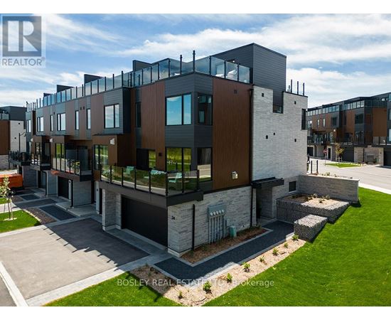 A modern multi-story residential building with a mix of dark and light exterior materials.