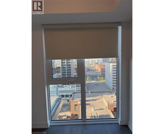 A window with a view of a cityscape.