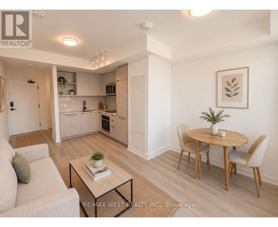 A modern living room with a dining table and chairs.