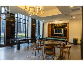 A dining room with a table set for four.