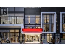 A modern building with a red awning that says 34 Tubman.
