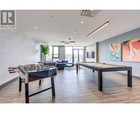 A pool table in a room with a view of the city.