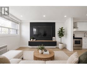 A modern living room with a flat screen TV and a coffee table.