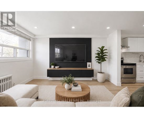 A modern living room with a flat screen TV and a coffee table.