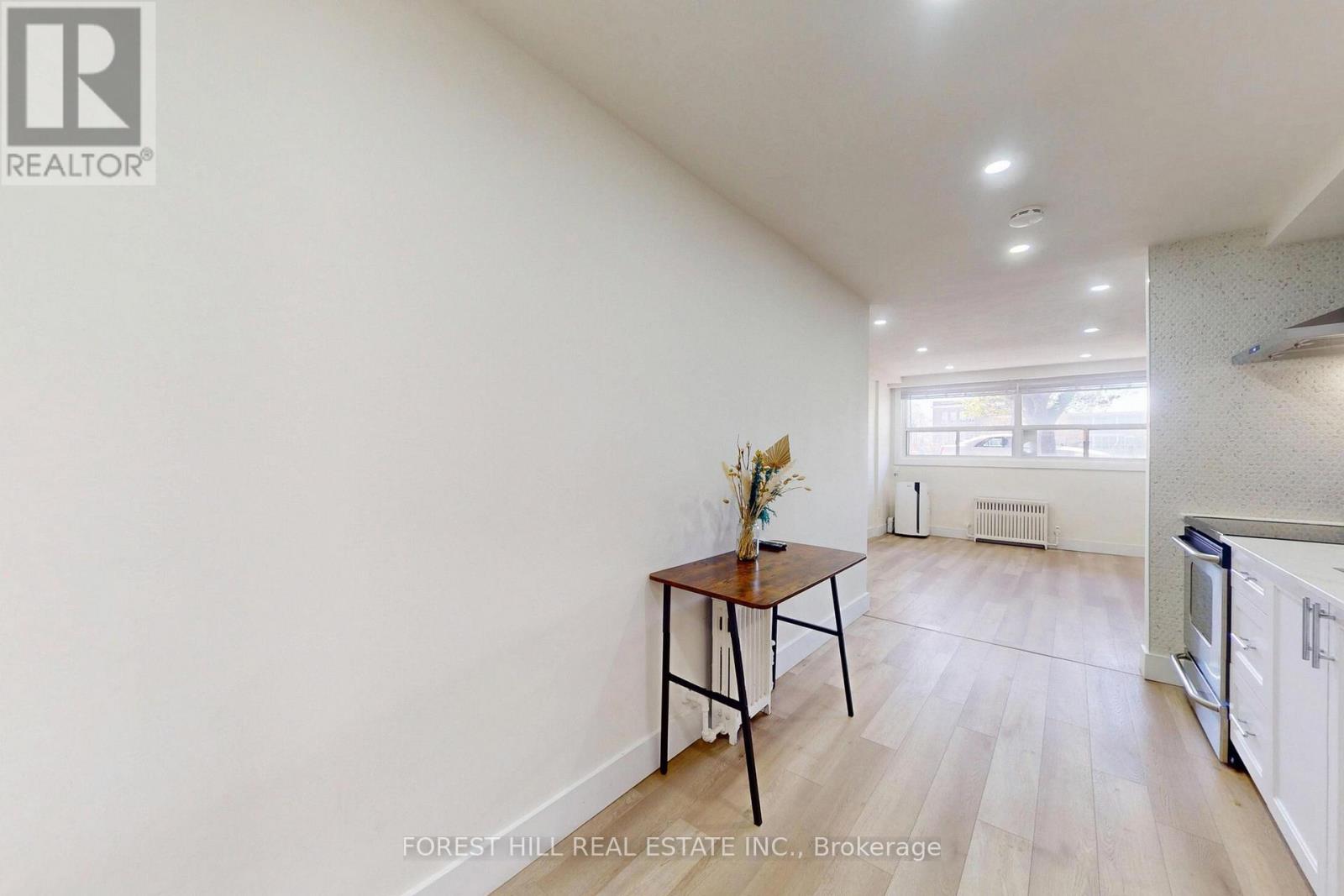 A room with a table and chairs in it.