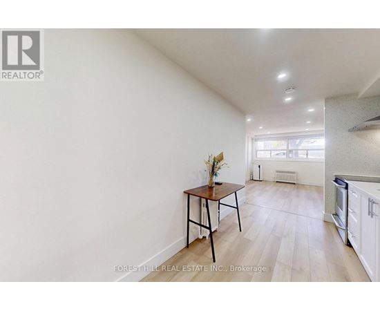 A room with a table and chairs in it.
