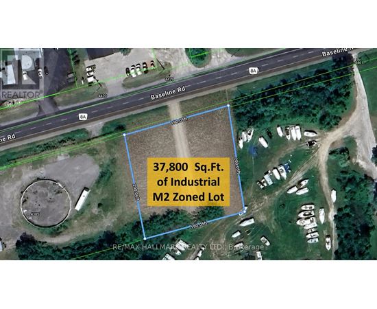 A satellite image shows a blue outlined area with a road and buildings in the background.