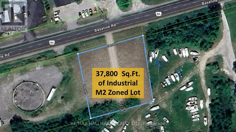 A satellite image shows a blue outlined area with a road and buildings in the background.