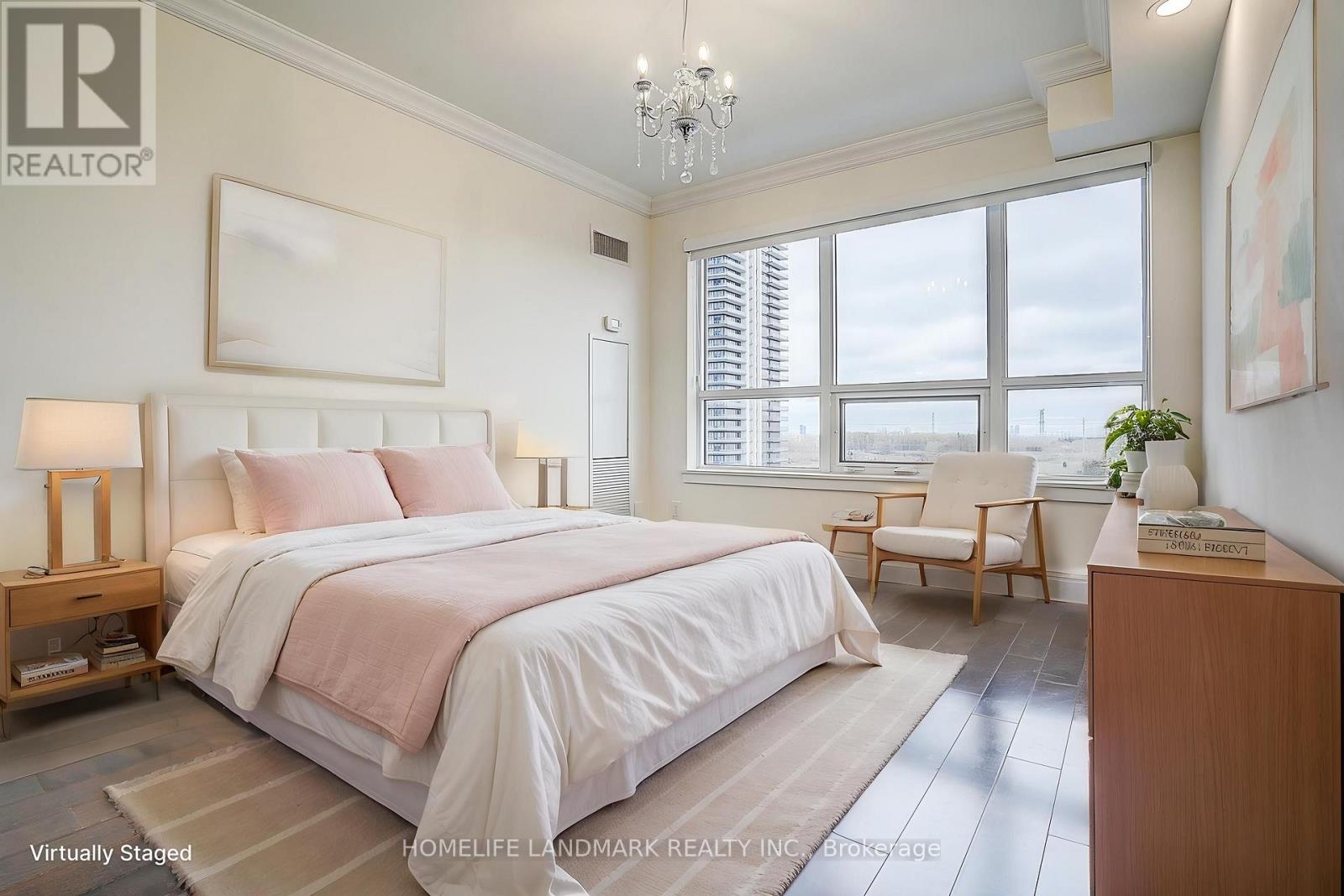 A bedroom with a large bed and a window with blinds.