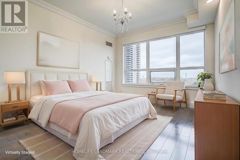 A bedroom with a large bed and a window with blinds.