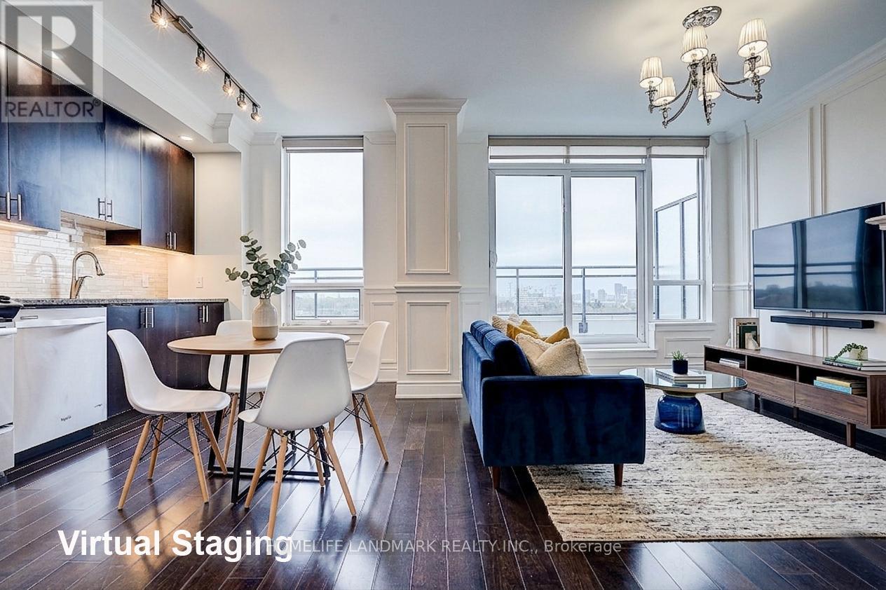 A modern living room with a dining area and a kitchen in the background.