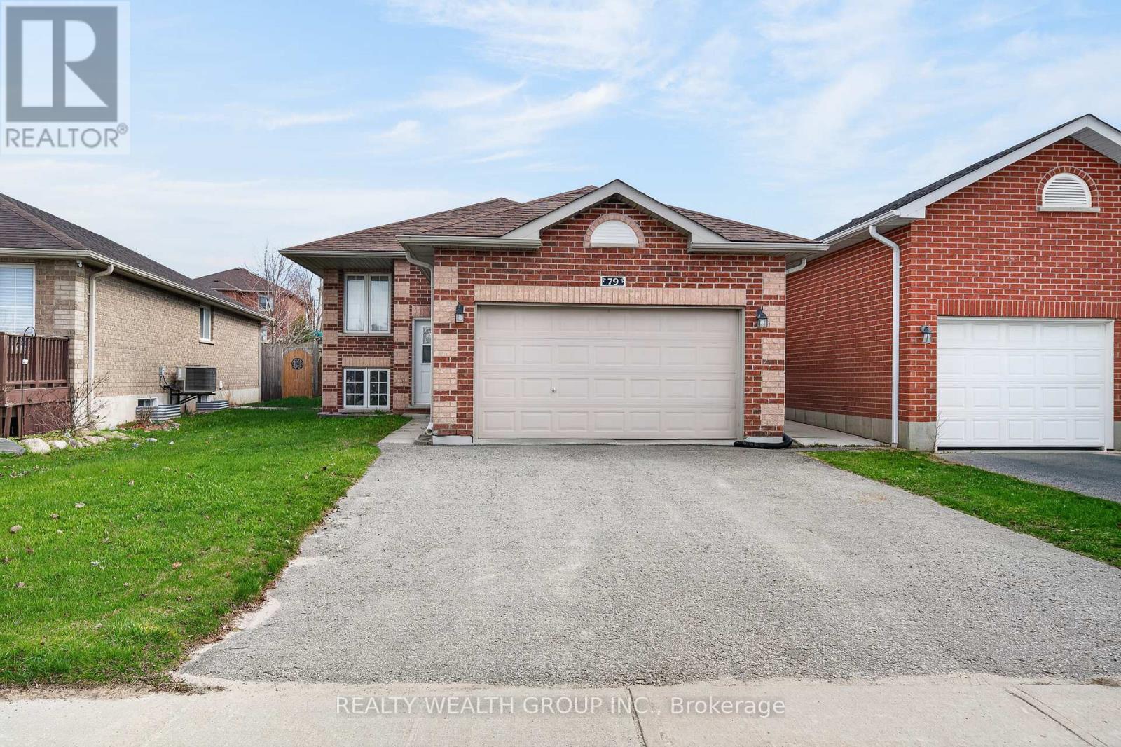 A house with a garage is for sale.