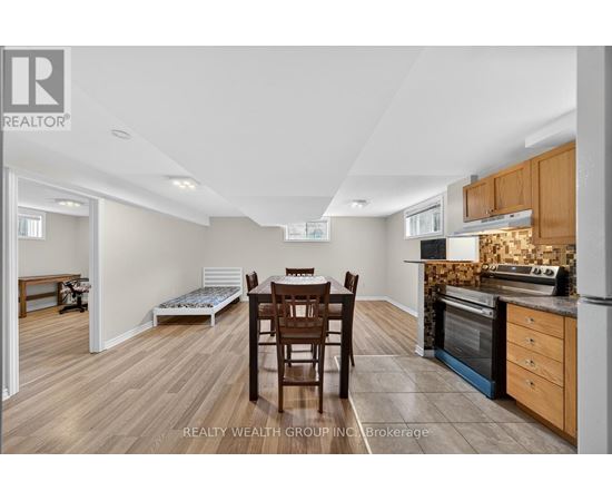 A kitchen with a table and chairs in the middle of the room.
