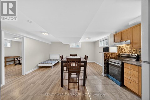 A kitchen with a table and chairs in the middle of the room.