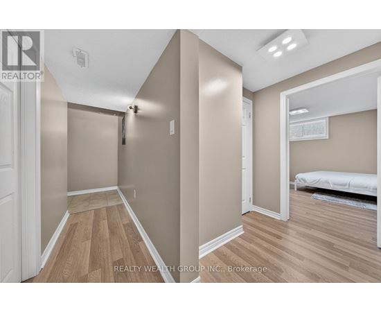 A bedroom with a bed and a dresser in a house.