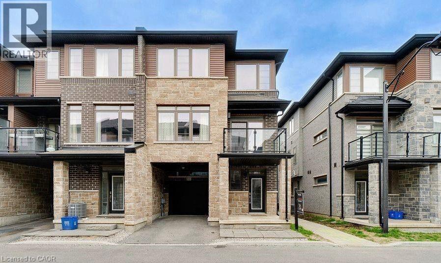 A building with a balcony and a garage door.