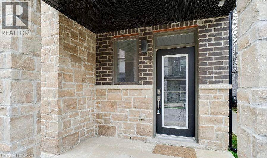 A house entrance with a glass door and a window.