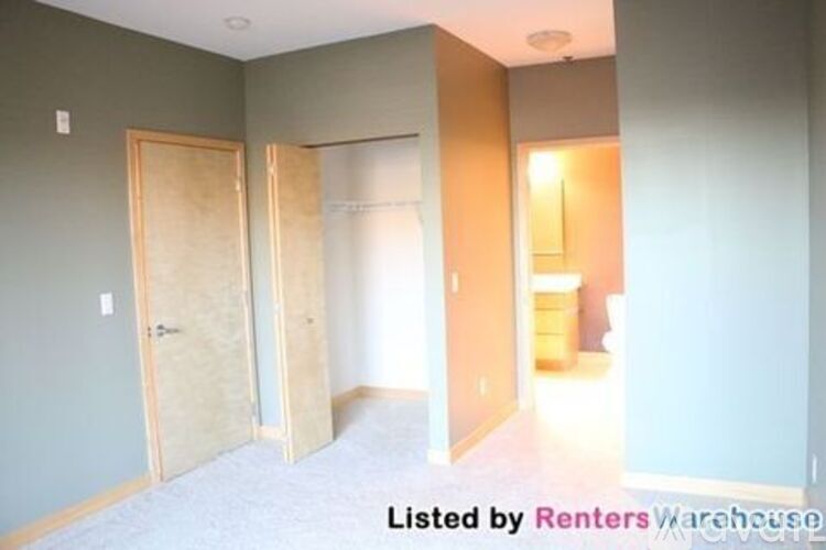 A room with two doors and a window.