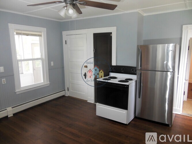A kitchen with a stove and refrigerator in it.