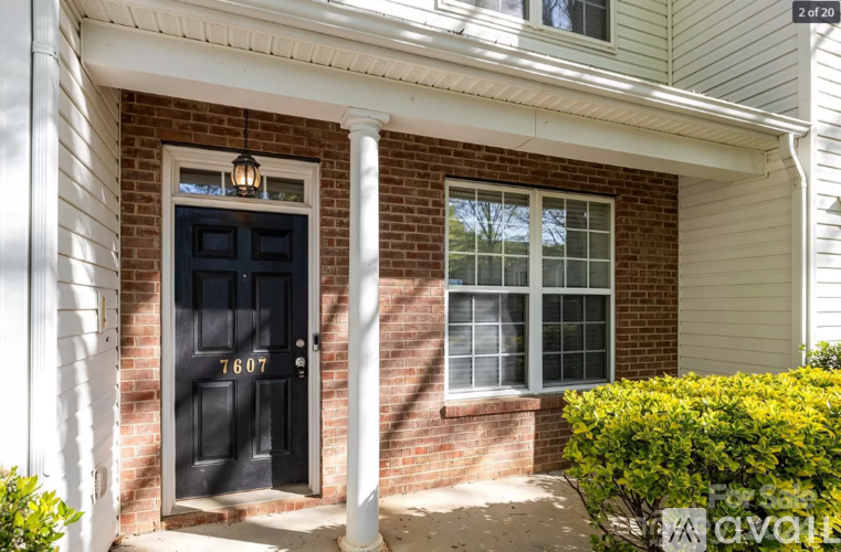 A house with a black door and a window.