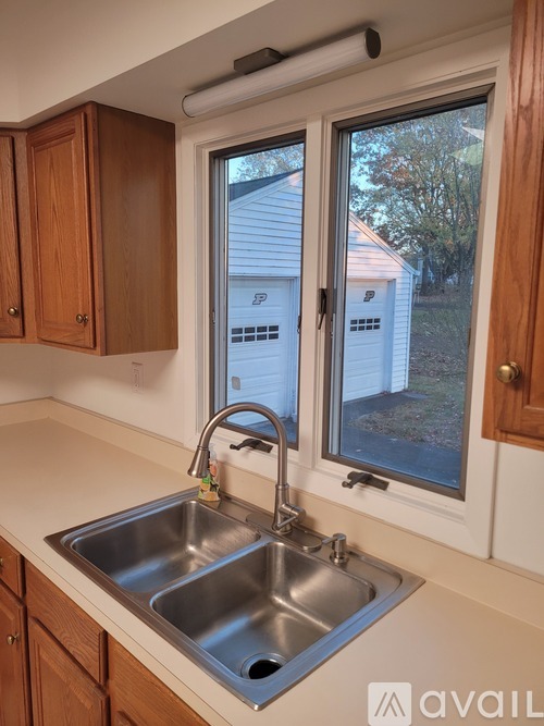 A kitchen with a sink and a window.
