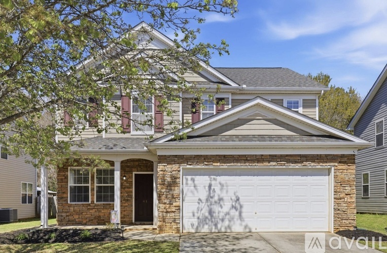 A house with a garage is for sale.