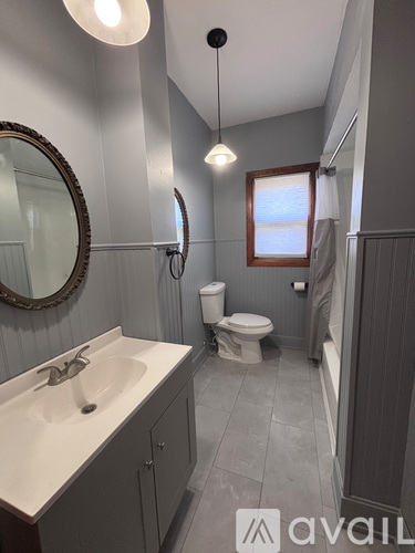 A bathroom with a toilet and a sink.