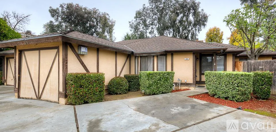A house with a brown roof and a garage.
