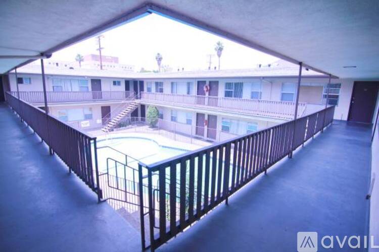A balcony with a pool table in the middle.