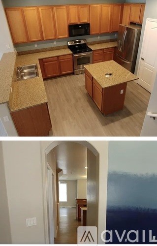 A kitchen with wooden cabinets and a countertop.