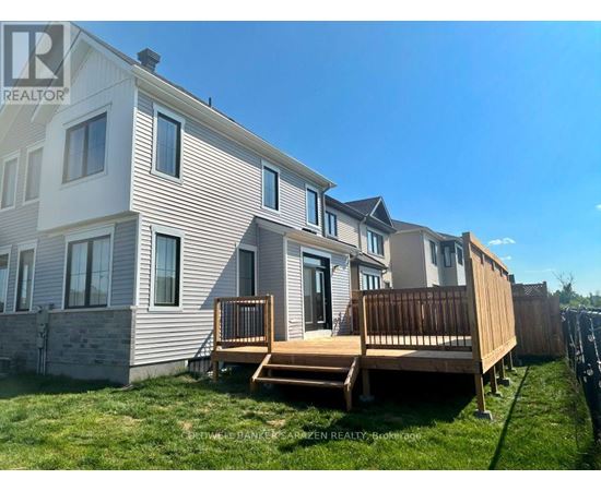 A sunny day at a residential area with houses and green lawns.