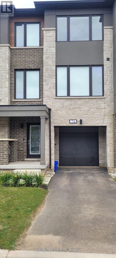 A modern two-story building with a garage door.